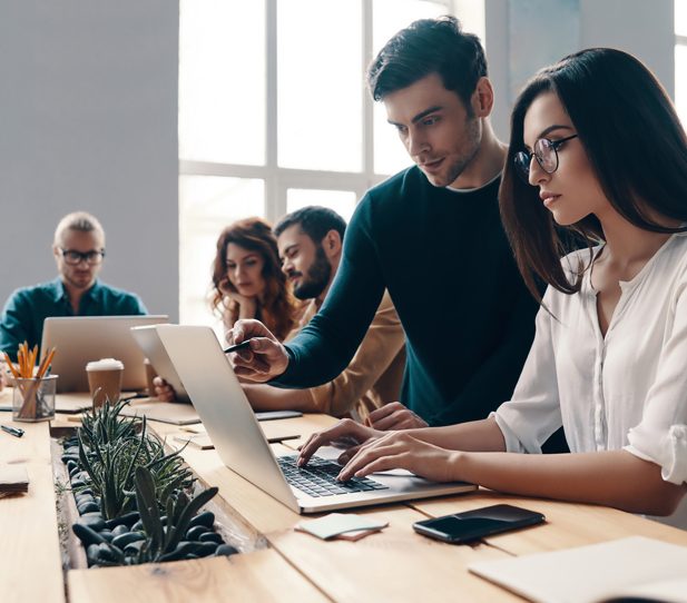 Team working together. Group of young modern people in smart cas